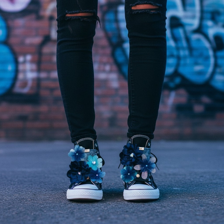 Black converse shoes styled with LŪPZ Fig shoe accessories, shown on a model standing in front of a graffiti brick wall