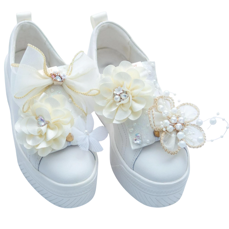 LŪPZ Champagne white leather sneakers adorned with pearl and crystal flowers and bows. Ideal for weddings.